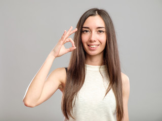 Fototapeta premium Girl showing OK sign
