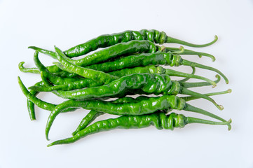 green hot pepper on a white background