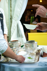 waiters serve ice cream during a party