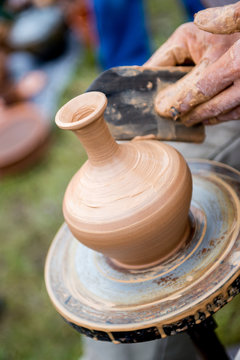 Master makes a jug out of clay