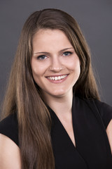 casual brunette on grey background