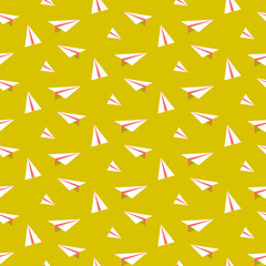 Origami paper plane seamless vector pattern. White and green planes on blue background. Minimalist style textile fabric ornament.