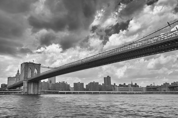 Black and white Brooklyn Bridge and New York skyline.