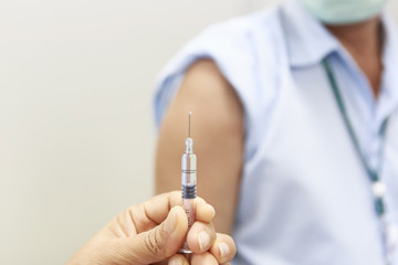 Hand holding syringe for vaccination.Selective focus.Medical concept.