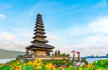 Hindu temple in the mountains of Bali, (Pura Ulun Danu Batur) is a popular tourist destination with hundreds of visitors each day. Here it is shown at sunrise on a beautiful day.
