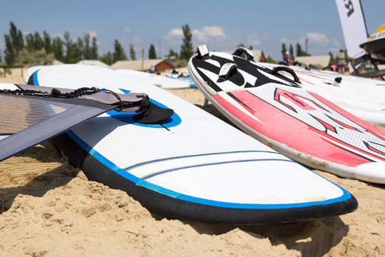 Windsurfing Board With Sail Lying On The Sand