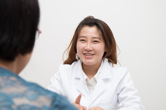 Asian Female doctor and patient