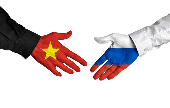 Vietnam and Russia leaders shaking hands on a deal agreement