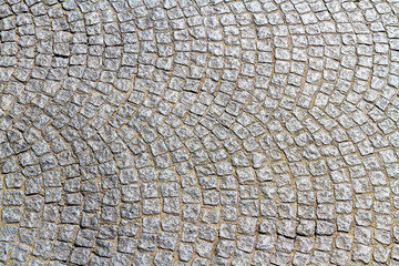 Cobble stones making curved pattern.