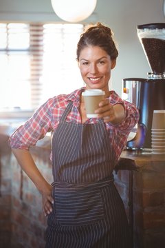 Waitress holding a cup of coffee