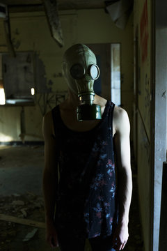 Man with a Gas Mask in an Abandoned House