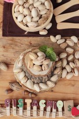 Pistachios is delicious for healthy on wood background.