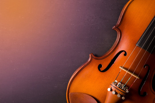 still life of vintage violin on white wooden background
