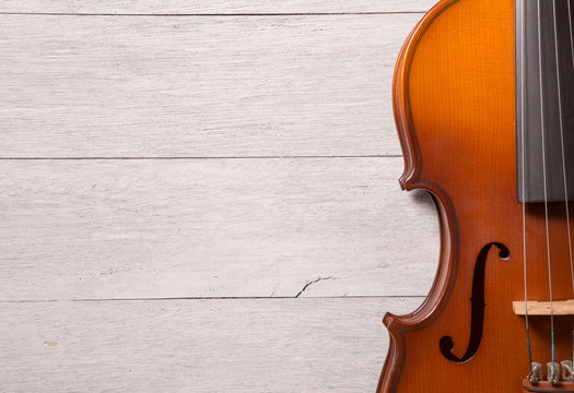 still life of vintage violin on white wooden background