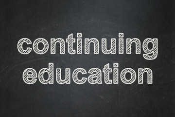 Obraz premium Studying concept: Continuing Education on chalkboard background
