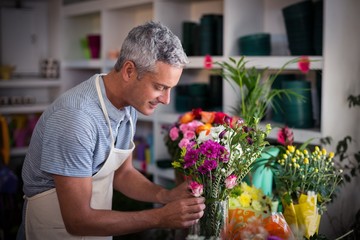 Florist preparing a flower bouquet