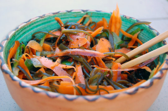 kelp noodles salad with carrot and cucumber, soy sauce ans wasab