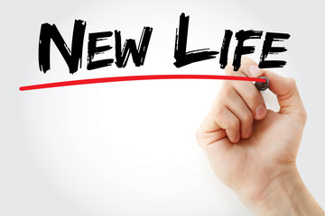 Hand writing New life with marker, business concept background