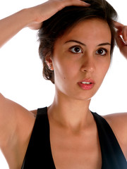 young woman in evening dress fixing her hair