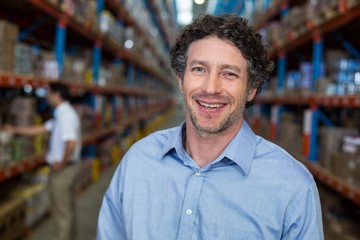 Fototapeta premium Portrait of happy manager posing and looking the camera