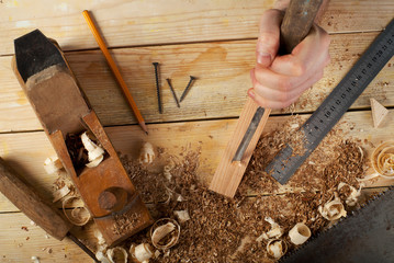 Carpenter tools on wood table background. Top view. Copy space