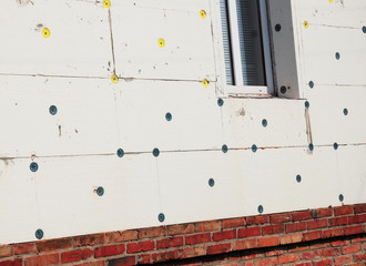 Exterior House Wall Insulation with Styrofoam Sheet Insulation. House Energy Saving.