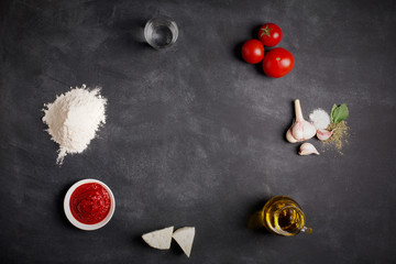 Ingredients for pizza on the chalkboard