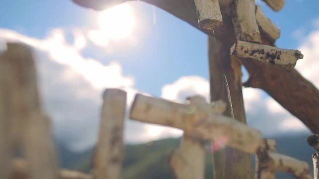 Breathtaking view of rice terraces and mountains during sunrise with close up on handmade Hapao Village sign near Batad, Ifugao, Philippines.