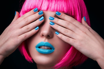 Potrait of young woman with pink hair