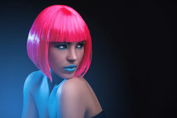 Potrait of young woman with pink hair