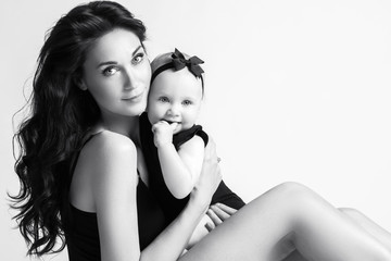 Fototapeta premium Young mother and her beautiful daughter