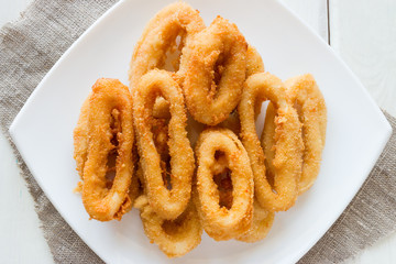 squid rings in batter on a white plate