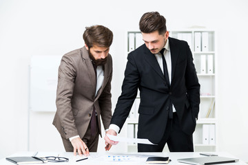 Businessmen doing paperwork