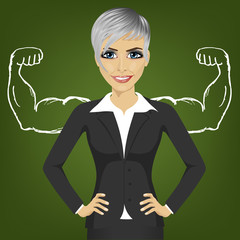 Business woman with strong arm muscles for success standing with hands on hips