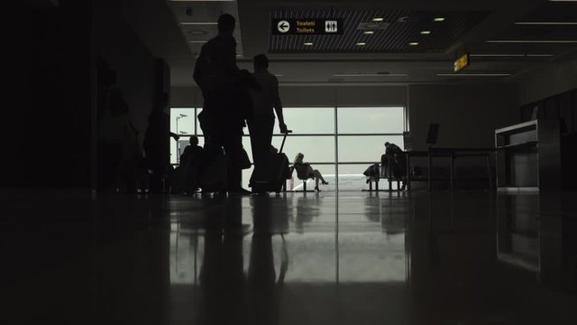 People are going at the boarding gate at the airport