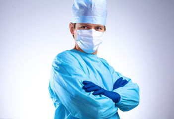 young surgeon standing with his arms crossed