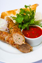 lyulya kebab with red sauce
