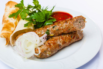 lyulya kebab with red sauce
