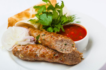 lyulya kebab with red sauce