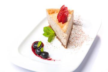 Cheesecake with cherries on plate