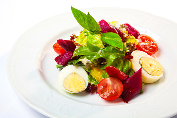 Salad with eggs and cherry
