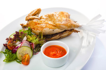 Chicken with sauce and salad