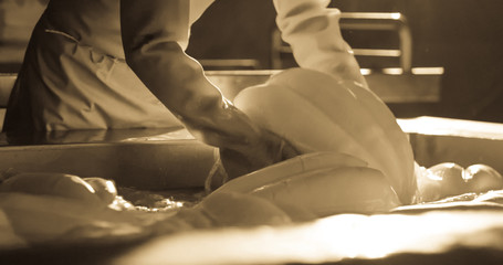 Production of provolone cheese.