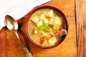 Pea soup with smoked ribs and croutons