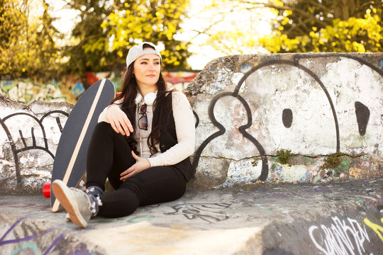 Young woman relaxing at the skatepark