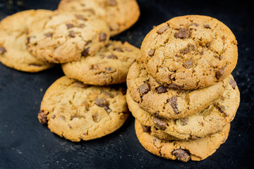Chocolate chips cookies isolated on black background