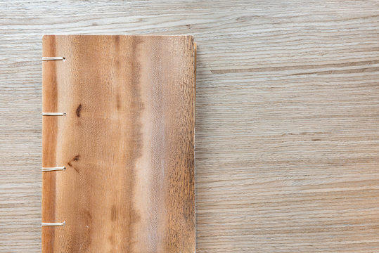 wooden notebook on wooden background