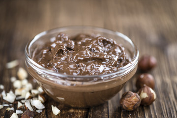 Bowl with Chocolate Cream (on wooden background)