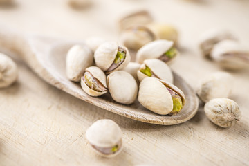 Whole Pistachios on wood