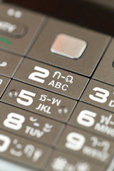 keypad of a cell phone number.
